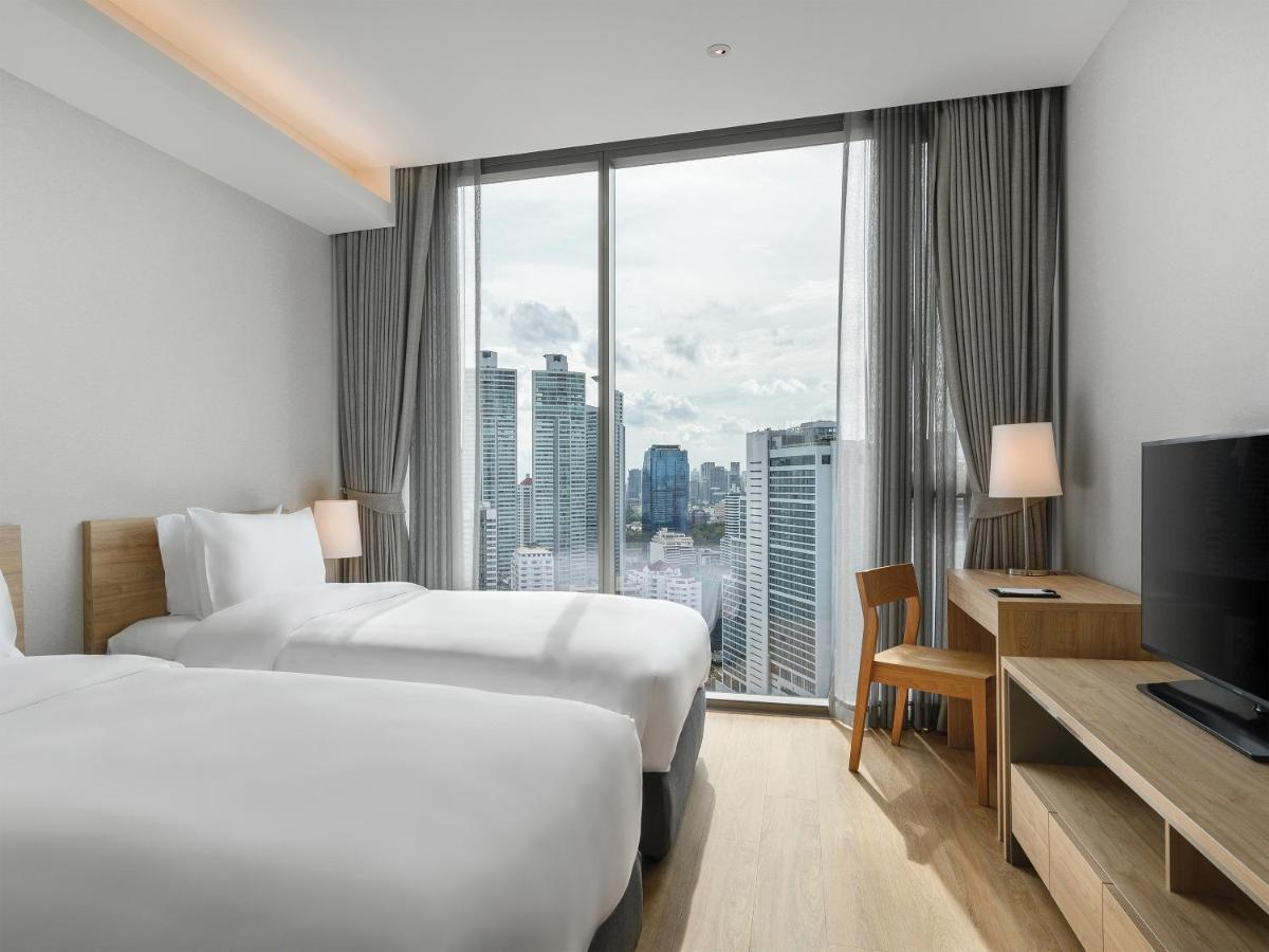 Oakwood Suites Bangkok Exterior foto Deluxe Room