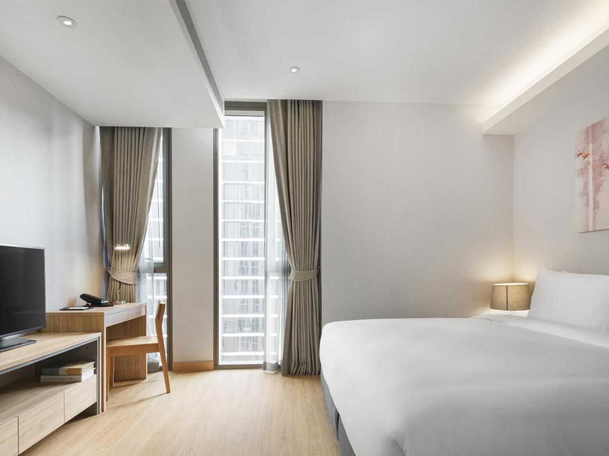 Oakwood Suites Bangkok Exterior foto Deluxe Room