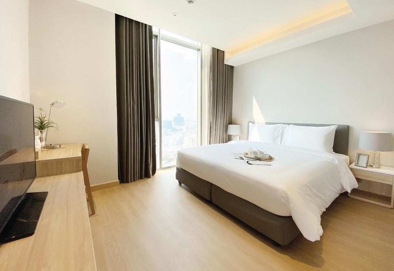 Oakwood Suites Bangkok Exterior foto Deluxe Room